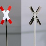 Andreaskreuz mit fein gekanteten Flügeln und Mastschellen Andreaskreuz mit fein gekanteten Flügeln und Mastschellen